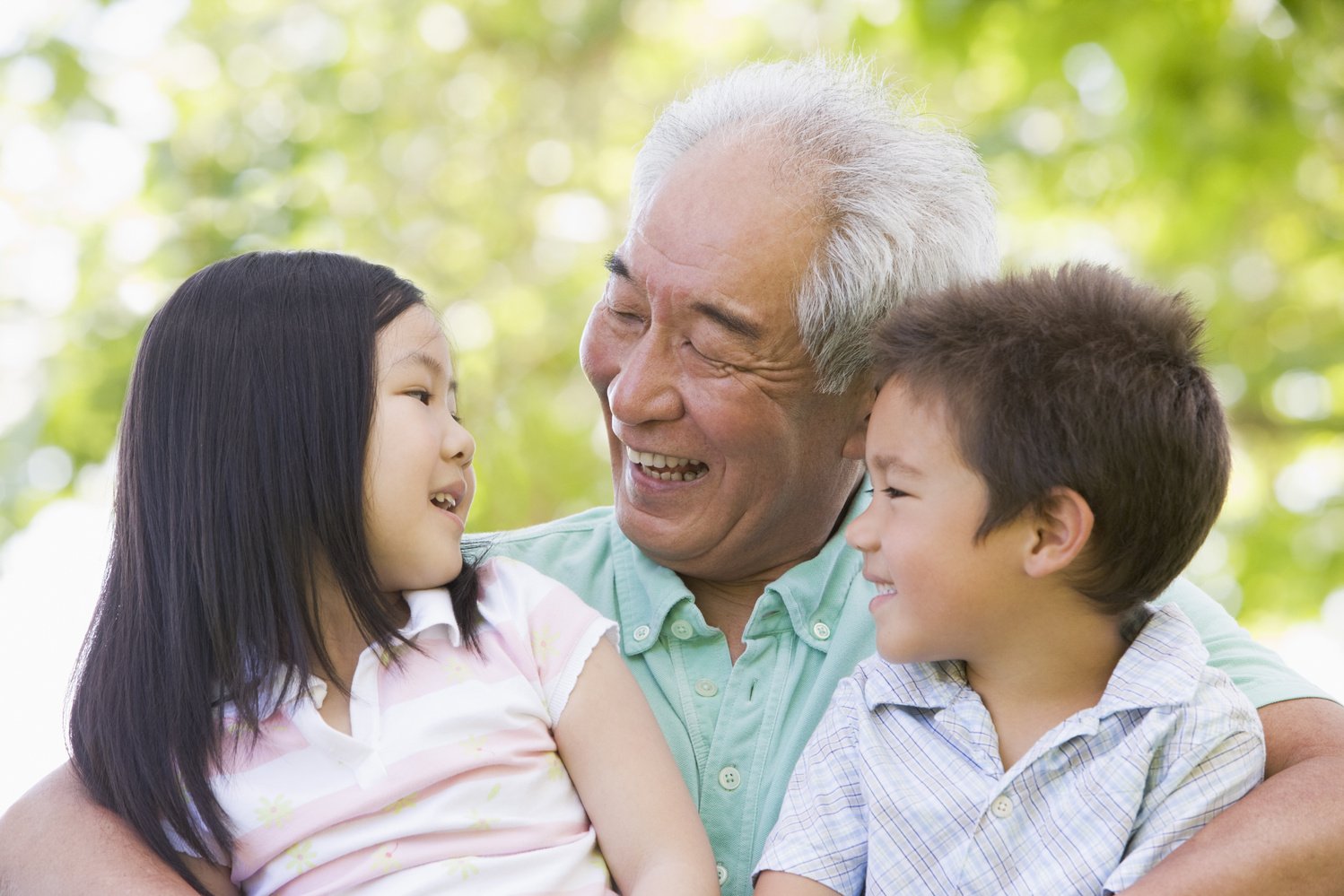 Grandfather Laughing with Grandchildren