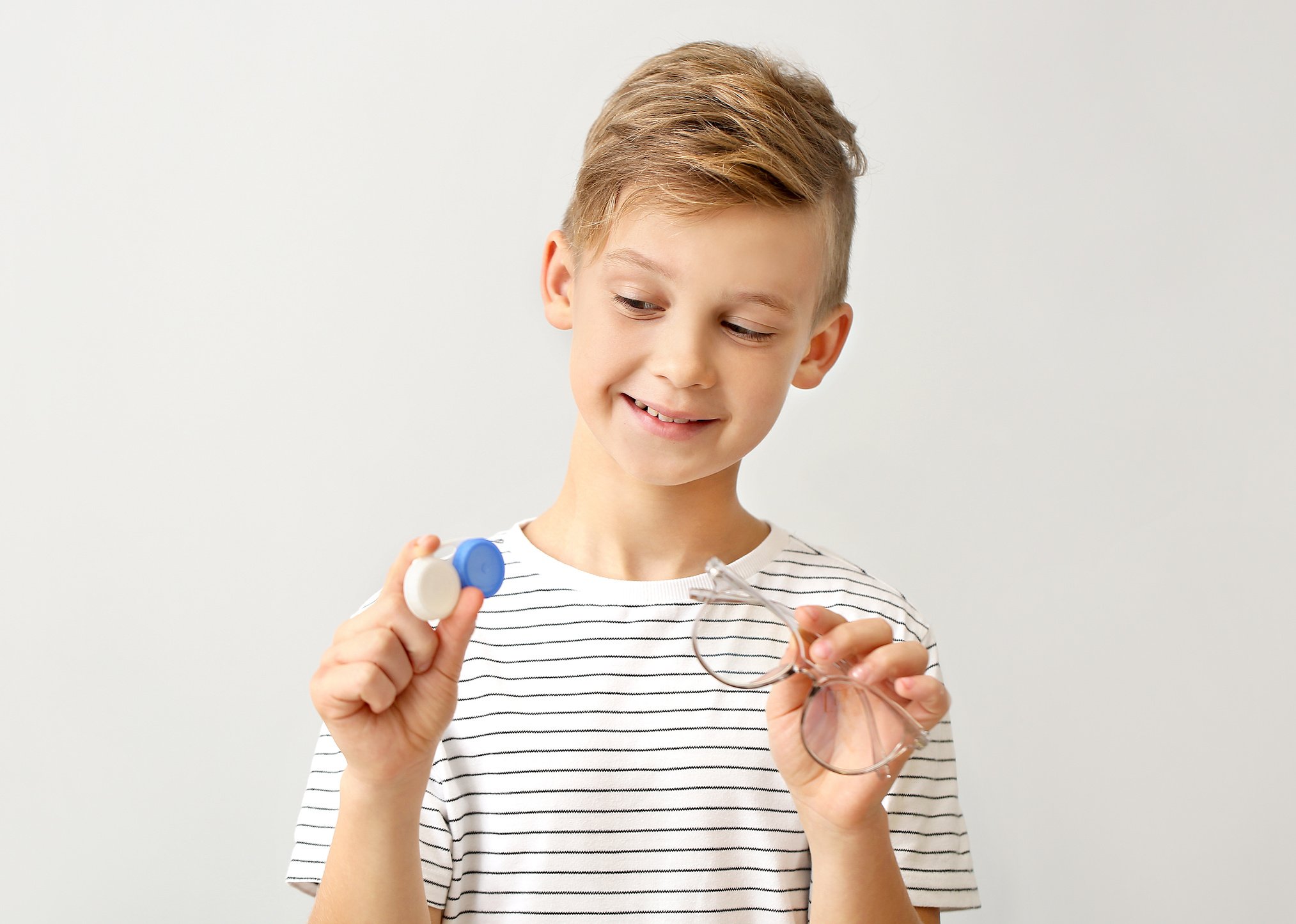 Little Boy with Contact Lens Case and Eyeglasses